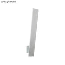 Minimalist black & white aluminum shade direct wired sconce bedroom