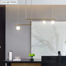Minimalist brass and white glass ceiling light for kitchen island