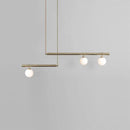 Minimalist brass and white glass ceiling light for kitchen island