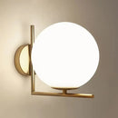 Minimalist brass angle arm opaline glass wall sconce bedroom light