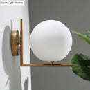 Minimalist brass angle arm opaline glass wall sconce bedroom light
