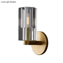 Minimalist brass ribbed glass wall sconce for living room