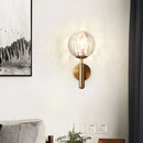Minimalist brass textured glass globe wall mount light for bedroom