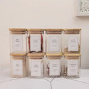 Minimalist glass jar with bamboo lid and labels – kitchen storage