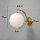 Minimalist gold glass ball wall sconce for bedroom