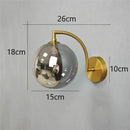 Minimalist gold glass ball wall sconce for bedroom