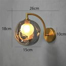 Minimalist gold glass ball wall sconce for bedroom
