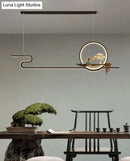 Minimalist gold linear hanging lamp study room bonsai tree design