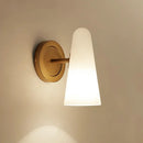 Minimalist gold wall sconce light with frosted glass shade living room