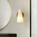 Minimalist gold wall sconce light with frosted glass shade living room