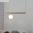Minimalist golden glass sphere pendant light dining room