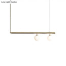 Minimalist golden glass sphere pendant light dining room