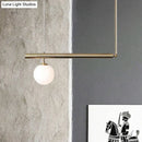 Minimalist golden glass sphere pendant light dining room