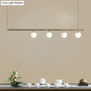 Minimalist golden glass sphere pendant light dining room