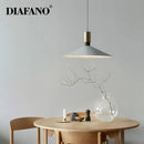 Minimalist gray and brass dimming pendant light for dining room