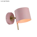 Minimalist pink and brass cylinder wall sconce – corridor light