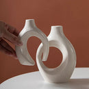 Minimalist speckled off-white ceramic donut candle holder dining room