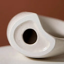 Minimalist speckled off-white ceramic donut candle holder dining room