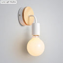 Minimalist white metal and wood bare bulb wall sconce bedroom light