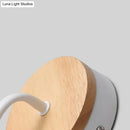 Minimalist white metal and wood bare bulb wall sconce bedroom light