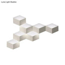 Minimalist white metallic geometric wall mount light for corridor