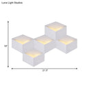 Minimalist white metallic geometric wall mount light for corridor