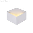 Minimalist white metallic geometric wall mount light for corridor