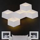 Minimalist white metallic geometric wall mount light for corridor
