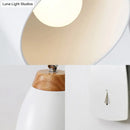 Minimalist white tapered wall light with wood accents – study desk lamp