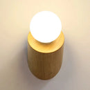 Minimalist wood wall lamp with frosted bulb for bedroom or living room