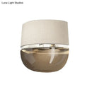 Modern arched beige & amber wall sconce bedroom tan glass light