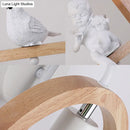 Modern beige wooden arched wall lamp with bird decor for bedroom