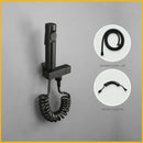 Modern bidet faucet set with coiled hose for bathroom