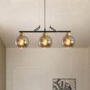 Modern black and brass 3-bulb smoke gray glass pendant dining hall island