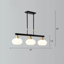 Modern black and brass linear hanging lamp with oval opal glass dining room