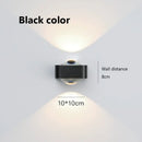 Modern black and copper bedroom wall lamp with glass dome