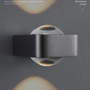 Modern black and copper bedroom wall lamp with glass dome