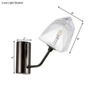 Modern black and gold faceted glass wall sconce stairway light