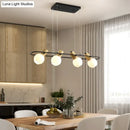 Modern black and wood frosted glass orb pendant light kitchen island