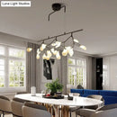 Modern black branching chandelier with frosted globes – dining room