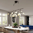 Modern black branching chandelier with frosted globes – dining room