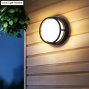 Modern black circular led wall lamp – outdoor warm color lighting