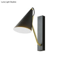 Modern black cone shade wall sconce with brass arm – bedroom light
