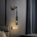 Modern black cylindrical wall sconce with frosted glass for bedroom