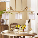 DecorBites™ Modern Black/Gold Chandelier Lamp with Clear Crystal Drum Shade, Bird Accent - 3 Heads Hanging Light Fixture
