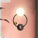 Modern black & gold wall sconce light with opal glass shade bedroom