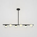 Modern black island pendant with clear glass globes dining room