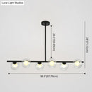 Modern black island pendant with clear glass globes dining room