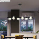 Modern black island pendant with clear glass globes dining room