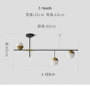 Modern black linear chandelier with glass ball shades for kitchen